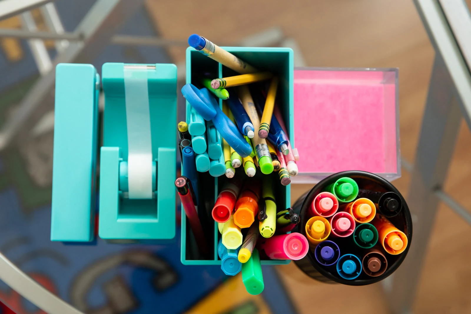 A desk with organized writing supplies and notebooks.